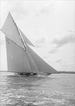 The 15 Metre cutter 'Ostara' sailing close-hauled, 1912. Creator: Kirk & Sons of Cowes.