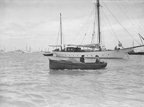 Motor boat 'Hubble-Bubble' and mariners, 1911. Creator: Kirk & Sons of Cowes.