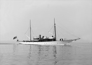 The motor yacht 'Atair' under way, 1914. Creator: Kirk & Sons of Cowes.