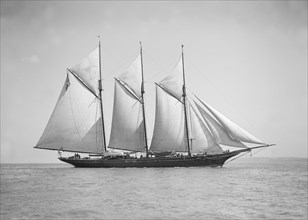 The three-mast auxiliary schooner 'Invincible', 1911. Creator: Kirk & Sons of Cowes.