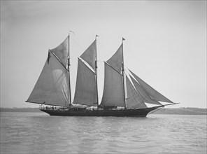 The three-mast auxiliary schooner 'Invincible', 1911. Creator: Kirk & Sons of Cowes.