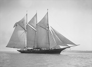 The three-mast auxiliary schooner 'Invincible', 1911. Creator: Kirk & Sons of Cowes.