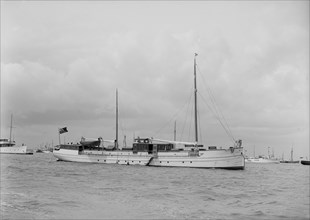 The motor yacht 'La Toquade' at anchor, 1939. Creator: Kirk & Sons of Cowes.