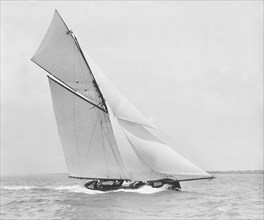 The gaff rigged cutter 'Bloodhound' sailing close-hauled. Creator: Kirk & Sons of Cowes.