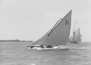 The 6 Metre 'Cheetal' (L21) sailing upwind, 1911. Creator: Kirk & Sons of Cowes.