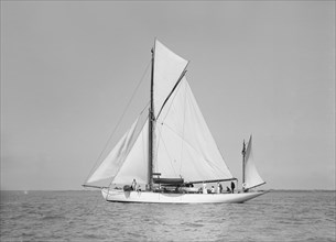 The yawl 'Suzanne' under sail, 1911. Creator: Kirk & Sons of Cowes.