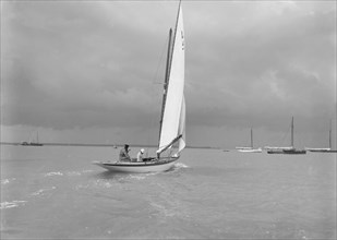 6 Metre Class 'Jonquil' (L5) with Captain R J Dixon at the helm. Creator: Kirk & Sons of Cowes.