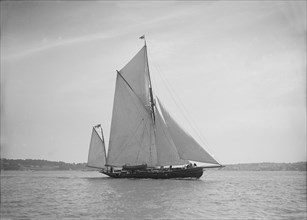 The 95 ft yawl 'Artemis' sailing close-hauled, 1911. Creator: Kirk & Sons of Cowes.