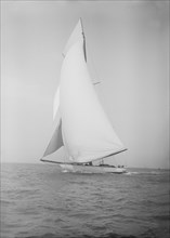 The 19-metre cutter 'Norada' sails in a following wind, 1911. Creator: Kirk & Sons of Cowes.