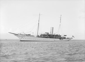 The steam yacht 'Eileen' at anchor, 1914. Creator: Kirk & Sons of Cowes.