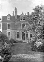 House and garden, c1900.  Creator: Kirk & Sons of Cowes.