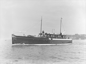 The motor yacht 'Marie' under way, 1921. Creator: Kirk & Sons of Cowes.