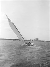 The 7 Metre yacht 'Genevia' (K7) beating to windward, 1912. Creator: Kirk & Sons of Cowes.