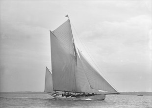 The 30 ton yawl 'Palmosa' under sail, 1911. Creator: Kirk & Sons of Cowes.