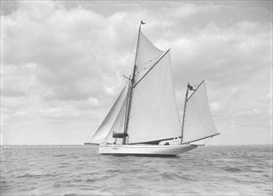 The yawl 'Pleiad' under sail, 1911. Creator: Kirk & Sons of Cowes.
