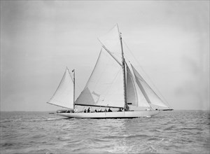 The yawl 'Nevada' under sail, 1911. Creator: Kirk & Sons of Cowes.