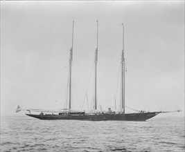 Three masted schooner at anchor. Creator: Kirk & Sons of Cowes.