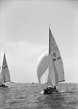 Sloop (Dragon? class) sailing with spinnaker, c1938. Creator: Kirk & Sons of Cowes.