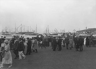 Crowds on the water front during a regatta, c1930. Creator: Kirk & Sons of Cowes.