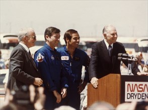 Astronauts John Young and Robert Crippen after landing, April 1981. Creator: NASA.