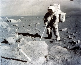 Harrison Schmitt works the scoop on the lunar surface, Apollo 17 mission, December 1972. Creator: NASA.