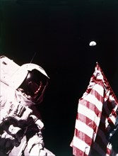 Harrison Schmitt with US flag on the surface of the Moon, Apollo 17 mission, December 1972. Creator: Eugene Cernan.
