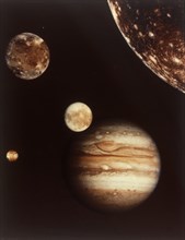 Colour composite of Jupiter and four moons. Creator: NASA.