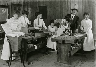 Women in a woodwork class at  Summer School, within 20 miles of Barry,  before 1918.