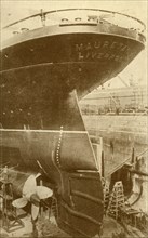 At Work on the Stern of the "Mauretania", in Dry Dock', c1930.