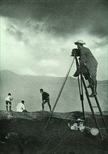 Photographing at the Crater's Lip, Aso-San', 1910.