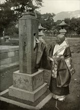 A Buddhist Priest and Praying-Wheel', 1910.