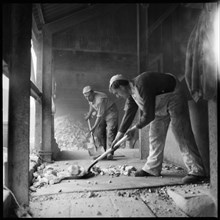 Men shovelling flint in a flint calcinating kiln, WJ Dolby works, Stoke-on-Trent, 1965-1968