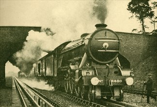 A "Pacific" Engine Picking Up Water at the Rate of 2,500 Gallons in Ten Seconds - London and North