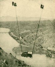 A Contractor's Engine Being Swung Across A Canyon, Rio Grande River, New Mexico', 1930.
