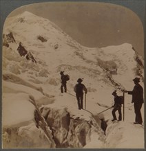 Ascent of Mt. Blanc - crossing Bossons Glacier - Grands Mulets in distance, Alps', 1901.