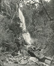 A waterfall near the village, Nuwara Eliya, Ceylon, 1895.