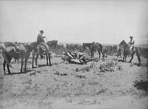 Inspecting a Brand on the Prairies', c1897.