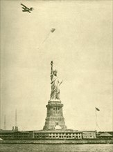The Statue of Liberty, with Uplifted Torchlight, New York Harbour', c1930.