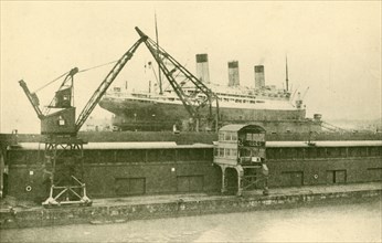 Lifitng a "Majestic" (56,551 Tons) in the Floating Dock at Southampton', c1930.