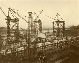 Cranes at Work on the London County Hall', c1930.