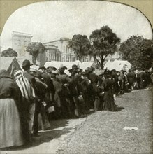 Forming bread line at Jefferson Square', 1906.