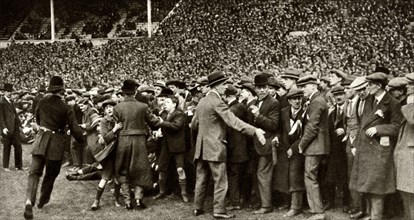 The first FA Cup Final is held at the new Wembley Stadium in London, 28 April 1923