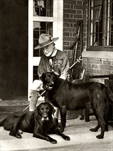 Robert Baden-Powell at home with his dogs, c1929