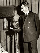 John Logie Baird watching the first play to be televised, 14 July 1930