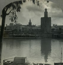 'The Tower of Gold and the Cathedral from across the Guadalquivir River, Seville, Spain', c1930s. Creator: Unknown.