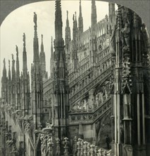 'The Cathedral of Milan, Italy - Up among Its Myriad Spires', c1930s. Creator: Unknown.