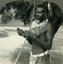 'The Finery of a Native Hunter in the Belgian Congo, Africa', c1930s. Creator: Unknown.