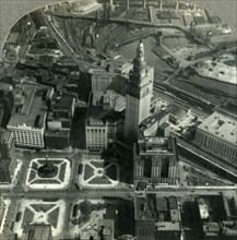 'An Air View of Downtown Cleveland - Public Square, Terminal Tower and the Winding Cuyahoga', 1930s. Creator: Unknown.