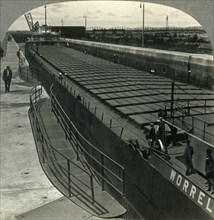 'Large Iron Ore Boat Coming into Sabin Locks. Sault Ste. Marie, Mich.', c1930s. Creator: Unknown.