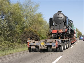 Locomotive being transported by heavy goods vehicle on A31 2015. Creator: Unknown.